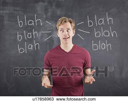 Studio shot of mid adult man with text on blackboard View Large Photo Image Stock Image - Studio shot of mid adult man with text on blackboard. Fotosearch