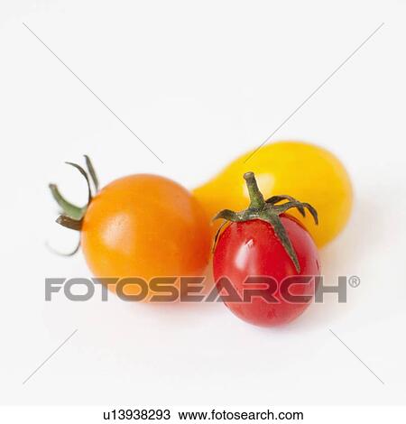Stock Image - Studio Shot of three Cherry Tomatoes. Fotosearch