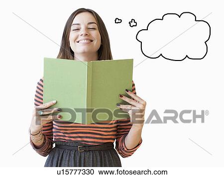 Studio shot young woman holding book with thought bubble next to View Large Photo Image Stock Image - Studio shot young woman holding book with thought bubble next to. Fotosearch