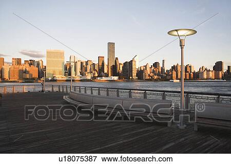 Stock Photo - Trump Plaza, Skyline with promenade at sunset. Fotosearch