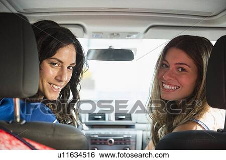 Two young women in car View Large Photo Image Stock Photograph - Two young women in car. Fotosearch