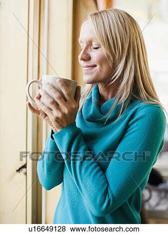 Stock Photo - Woman drinking coffee. Fotosearch
