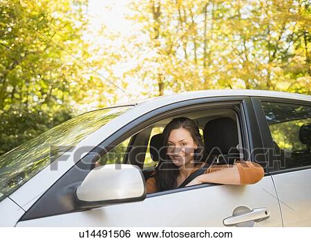 Stock Photograph - Woman driving car. Fotosearch