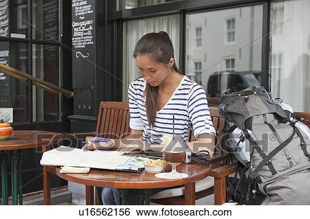 Young woman with backpack planning her journey View Large Photo Image Stock Photograph - Young woman with backpack planning her journey. Fotosearch