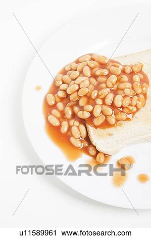 Baked beans and bread in plate View Large Photo Image Stock Image - Baked beans and bread in plate. Fotosearch