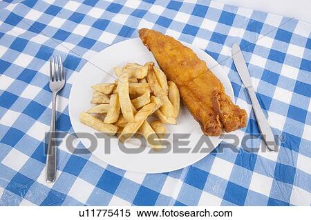Close-up of fries and meat with fork and table knife on table View Large Photo Image Stock Photography - Close-up of fries and meat with fork and table knife on table. Fotosearch