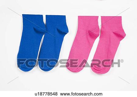 Stock Photo - Close-up of socks hanging over white background. Fotosearch