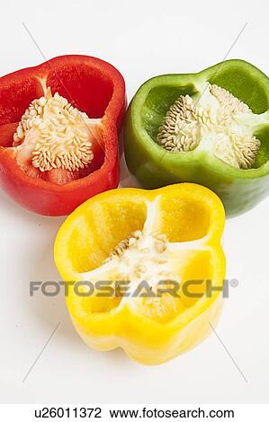 Stock Image - Cross section of different colored bell peppers. Fotosearch