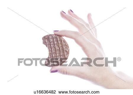 Detail shot of woman holding cookie over white background View Large Photo Image Stock Image - Detail shot of woman holding cookie over white background. Fotosearch