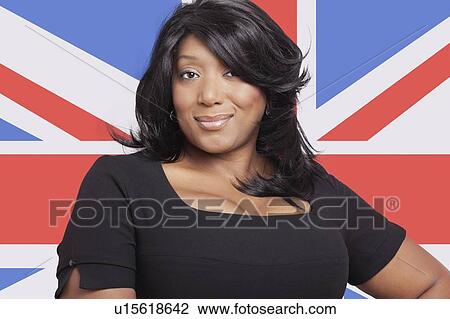 Portrait of casual mixed race woman against British flag View Large Photo Image Stock Image - Portrait of casual mixed race woman against British flag. Fotosearch