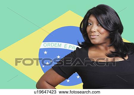 Portrait of casual mixed race woman over Brazilian flag View Large Photo Image Stock Image - Portrait of casual mixed race woman over Brazilian flag. Fotosearch