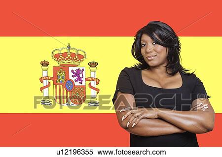 Portrait of casual mixed race woman against Spanish flag View Large Photo Image Stock Photography - Portrait of casual mixed race woman against Spanish flag. Fotosearch