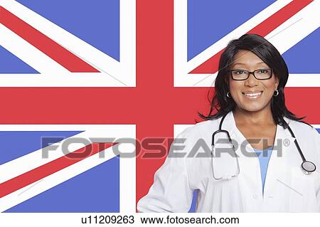 Portrait of confident mixed race female surgeon over British flag View Large Photo Image Stock Image - Portrait of confident mixed race female surgeon over British flag. Fotosearch
