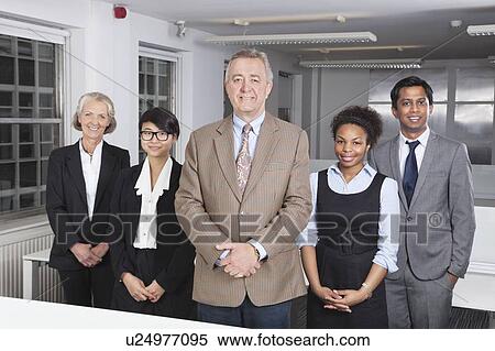 Portrait of confident multiethnic business group at office View Large Photo Image Stock Photography - Portrait of confident multiethnic business group at office. Fotosearch