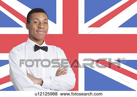Portrait of mixed race man against British flag View Large Photo Image Stock Photo - Portrait of mixed race man against British flag. Fotosearch