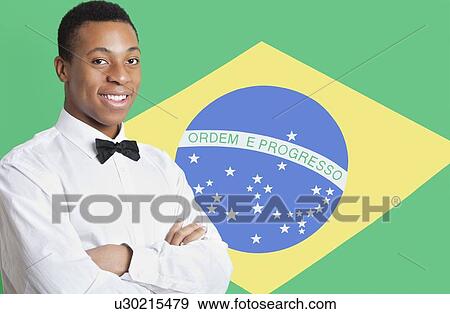 Portrait of mixed race man against Brazilian flag View Large Photo Image Stock Photo - Portrait of mixed race man against Brazilian flag. Fotosearch