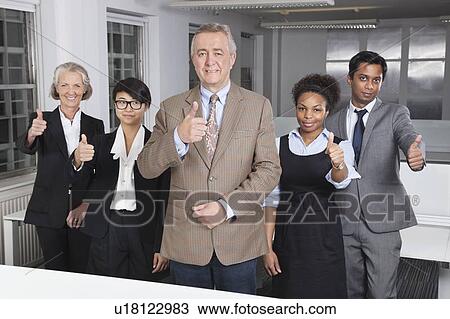 Portrait of multiethnic business group gesturing thumbs up at office View Large Photo Image Stock Image - Portrait of multiethnic business group gesturing thumbs up at office. Fotosearch