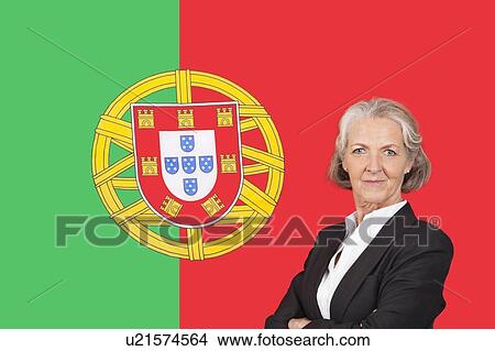 Portrait of senior businesswoman with pride over Portuguese flag View Large Photo Image Picture - Portrait of senior businesswoman with pride over Portuguese flag. Fotosearch