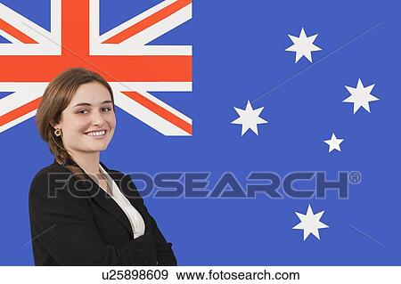 Portrait of young businesswoman smiling over Australian flag View Large Photo Image Stock Photo - Portrait of young businesswoman smiling over Australian flag. Fotosearch