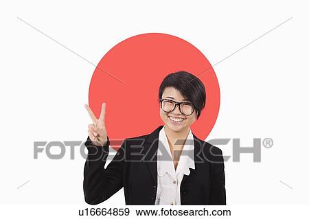 Portrait of young businesswoman gesturing peace sign over Japanese flag View Large Photo Image Stock Photo - Portrait of young businesswoman gesturing peace sign over Japanese flag. Fotosearch