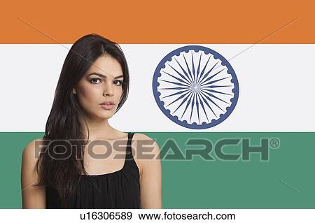 Portrait of young woman against Indian flag View Large Photo Image Stock Photo - Portrait of young woman against Indian flag. Fotosearch