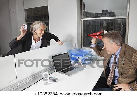 Picture - Side view of playful business colleagues in office. Fotosearch