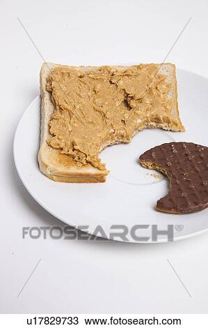 Slice of bread and chocolate biscuit on plate View Large Photo Image Stock Image - Slice of bread and chocolate biscuit on plate. Fotosearch