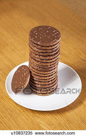 Stack of chocolate biscuits in plate View Large Photo Image Stock Photography - Stack of chocolate biscuits in plate. Fotosearch
