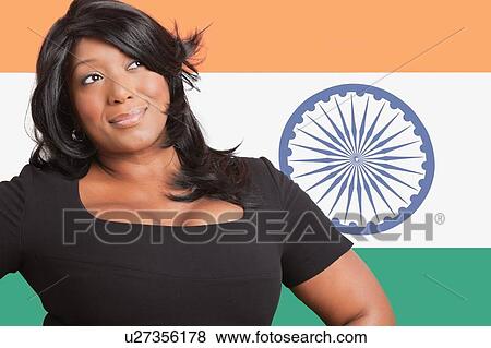 Thoughtful casual mixed race woman over Indian flag View Large Photo Image Stock Photo - Thoughtful casual mixed race woman over Indian flag. Fotosearch