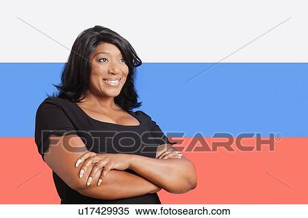 Thoughtful casual mixed race woman over Russian flag View Large Photo Image Stock Photography - Thoughtful casual mixed race woman over Russian flag. Fotosearch
