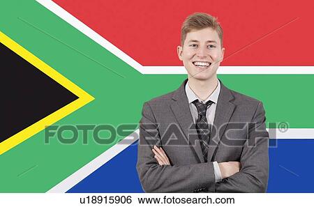 Young businessman with arms crossed over South African flag View Large Photo Image Stock Photograph - Young businessman with arms crossed over South African flag. Fotosearch