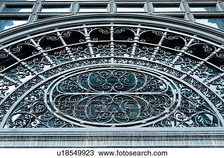Stock Image - Architectural details on an arch made from wrought iron, Montreal, Quebec, Canada. Fotosearch