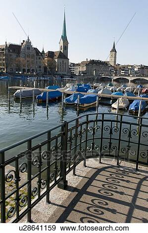 Boats moored at river dock, District 1, Zurich, Switzerland View Large Photo Image Stock Photo - Boats moored at river dock, District 1, Zurich, Switzerland. Fotosearch