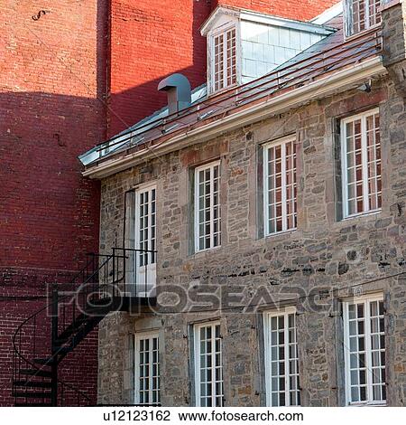 Stock Image - Brick façade of a building in, Ville-Marie, Montreal, Quebec, Canada. Fotosearch