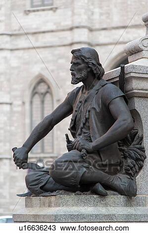 Stock Image - Close-up of a statue at Maisonneuve Monument, Place d'Armes, Ville-Marie, Montreal, Quebec, Canada. Fotosearch