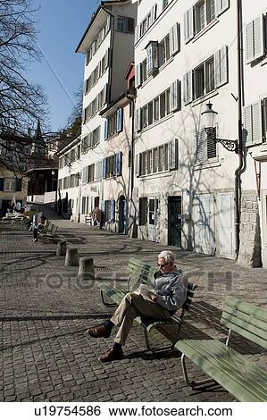 Elderly man sitting on a bench, Bahnhofstrasse, Zurich, Switzerland View Large Photo Image Stock Photograph - Elderly man sitting on a bench, Bahnhofstrasse, Zurich, Switzerland. Fotosearch