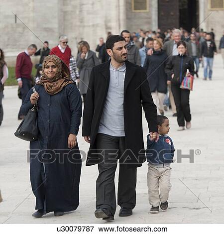 Stock Photo - Family walking on the street, Istanbul, Turkey. Fotosearch