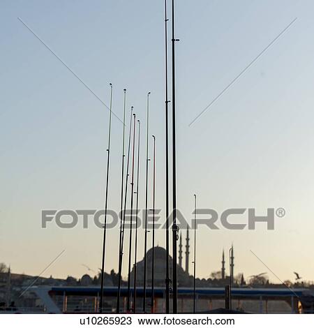 Stock Image - Fishing rod with Blue Mosque in the background, Istanbul, Turkey. Fotosearch