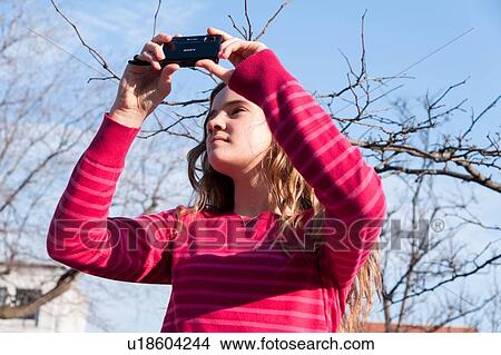 Girl taking picture with a camera, Ville-Marie, Montreal, Quebec, Canada View Large Photo Image Picture - Girl taking picture with a camera, Ville-Marie, Montreal, Quebec, Canada. Fotosearch