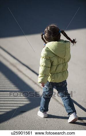 Little girl walking on a street, Zermatt, Valais Canton, Switzerland View Large Photo Image Stock Image - Little girl walking on a street, Zermatt, Valais Canton, Switzerland. Fotosearch