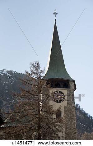 Low angle view of the clock tower of a church, Zermatt, Valais Canton, Switzerland View Large Photo Image Stock Image - Low angle view of the clock tower of a church, Zermatt, Valais Canton, Switzerland. Fotosearch