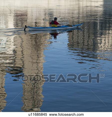 Man kayaking in the river, District 1, Zurich, Switzerland View Large Photo Image Stock Photography - Man kayaking in the river, District 1, Zurich, Switzerland. Fotosearch