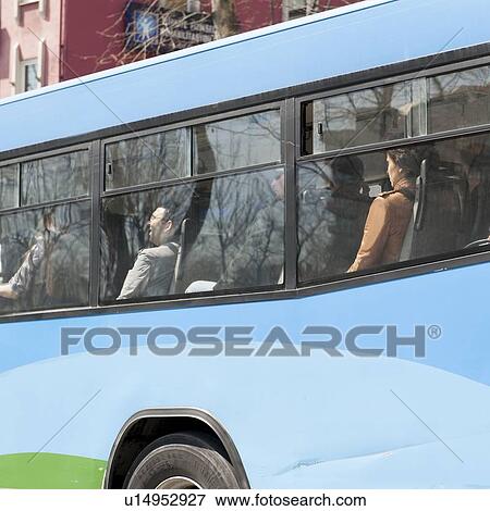 Passengers traveling in a bus, Istanbul, Turkey View Large Photo Image Stock Photo - Passengers traveling in a bus, Istanbul, Turkey. Fotosearch