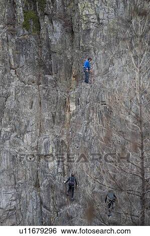 Stock Photograph - People rock climbing, Chamonix, Rhone-Alpes, France. Fotosearch