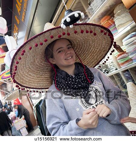 Portrait of a girl wearing a straw hat, Istanbul, Turkey View Large Photo Image Stock Image - Portrait of a girl wearing a straw hat, Istanbul, Turkey. Fotosearch