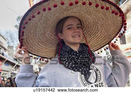Portrait of a girl wearing a straw hat, Istanbul, Turkey View Large Photo Image Stock Image - Portrait of a girl wearing a straw hat, Istanbul, Turkey. Fotosearch