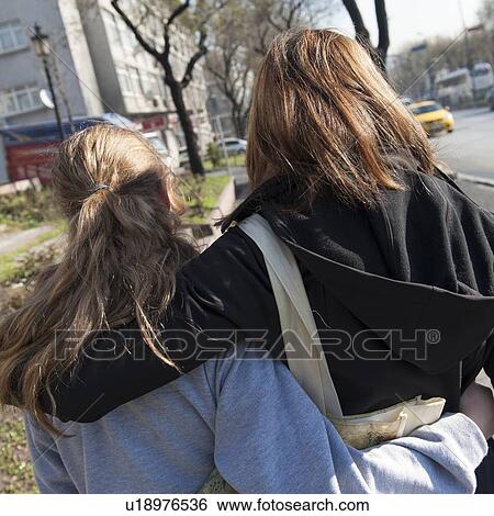 Rear view of a woman with her daughter, Istanbul, Turkey View Large Photo Image Stock Photograph - Rear view of a woman with her daughter, Istanbul, Turkey. Fotosearch