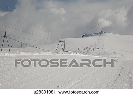 Stock Image - Ski lift cables in a ski resort, Zermatt, Valais Canton, Switzerland. Fotosearch