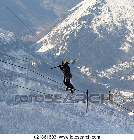 Skier climbing snow covered mountain side, Aiguille Du Midi, Mont Blanc, Chamonix, Rhone-Alpes, France View Large Photo Image Stock Image - Skier climbing snow covered mountain side, Aiguille Du Midi, Mont Blanc, Chamonix, Rhone-Alpes, France. Fotosearch