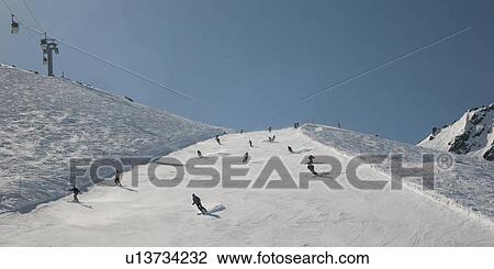 Skiers in action at Les Grands Montets ski area, Mont Blanc, Chamonix, Rhone-Alpes, France View Large Photo Image Stock Image - Skiers in action at Les Grands Montets ski area, Mont Blanc, Chamonix, Rhone-Alpes, France. Fotosearch